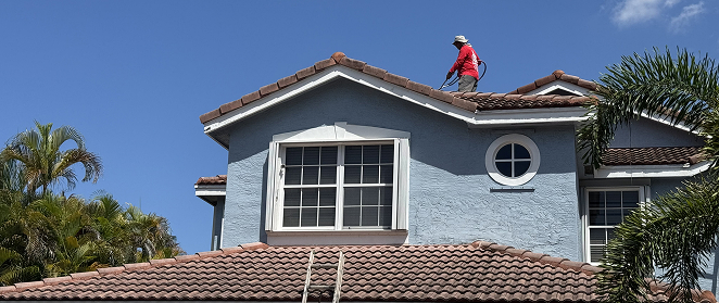 Painter working on a home - Commercial Painting & Waterproofing Contractors
