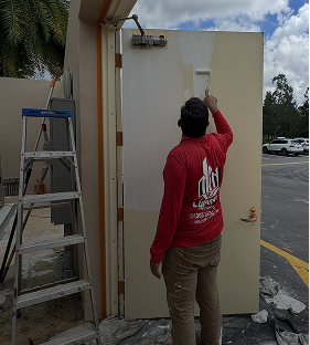 Waterproof coating application on a residential exterior wall